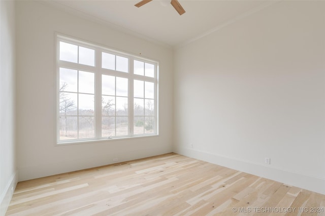 unfurnished room featuring ceiling fan, ornamental molding, and light hardwood / wood-style flooring