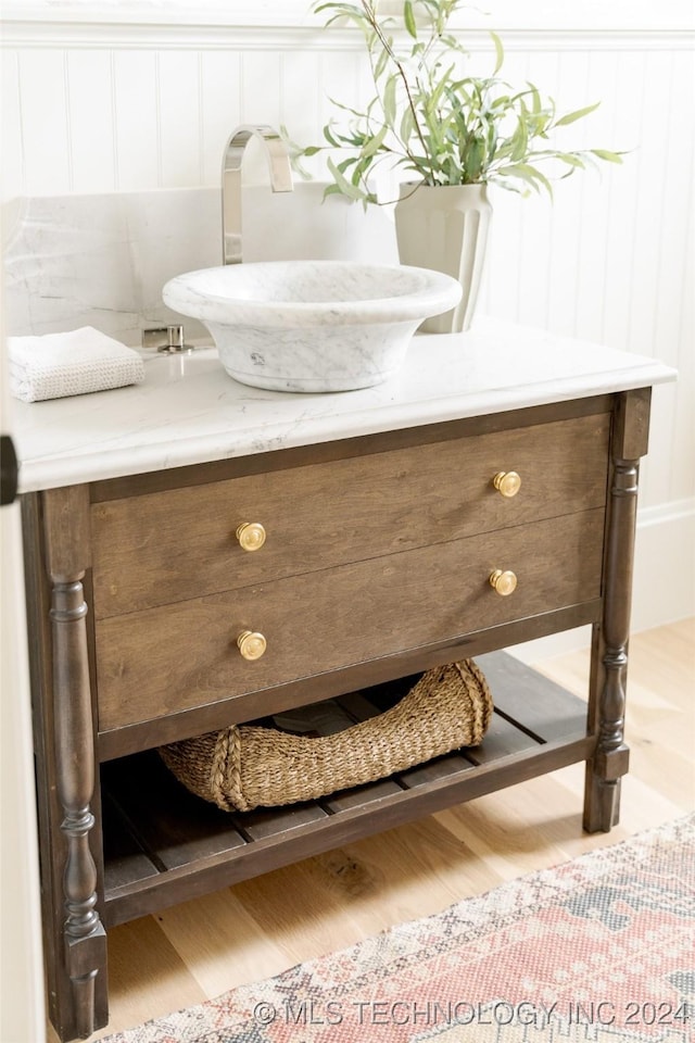 room details featuring sink and wood-type flooring