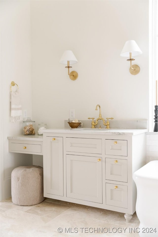 bathroom featuring tile patterned flooring and vanity