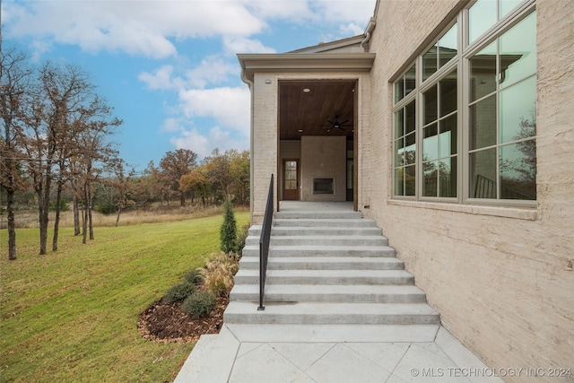 entrance to property featuring a yard