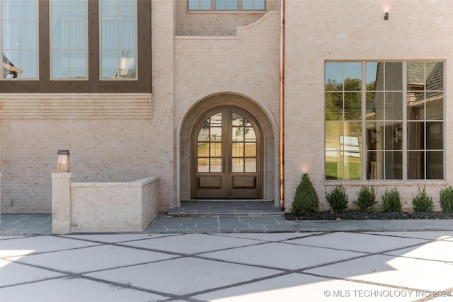 property entrance featuring french doors