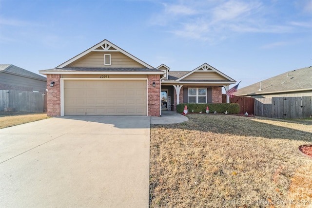 view of front of property with a garage and a front yard