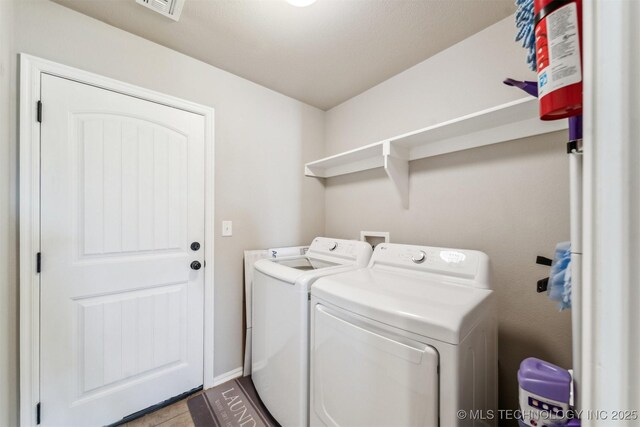 laundry room featuring washing machine and dryer