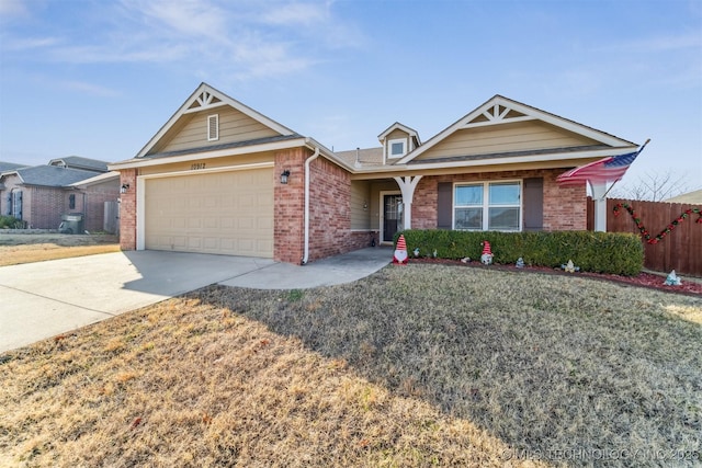 view of front of property with a garage and a front lawn