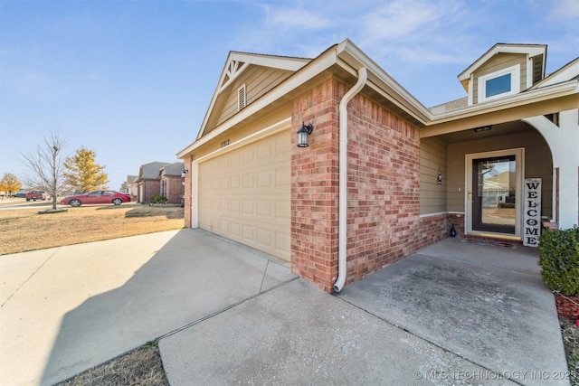 view of side of property featuring a garage