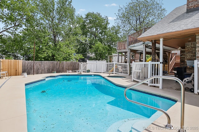 view of pool featuring a patio