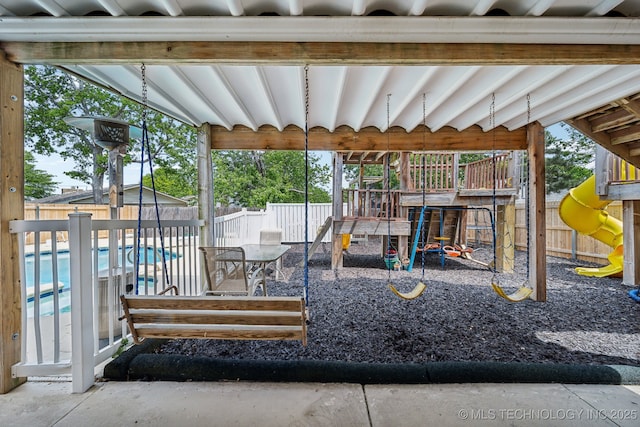 exterior space featuring a fenced in pool and a patio area