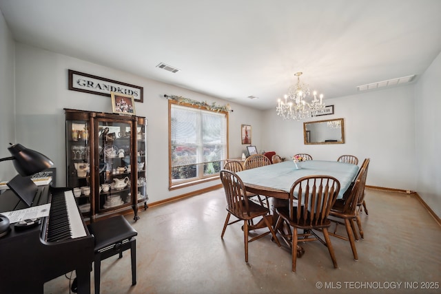 dining area with a notable chandelier