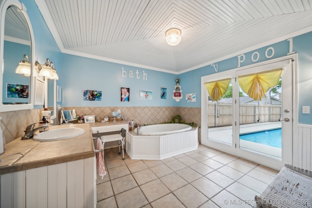 bathroom featuring tile patterned flooring, vanity, vaulted ceiling, and ornamental molding