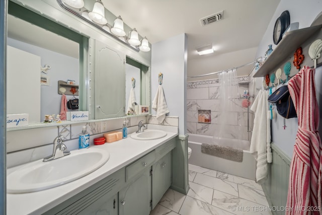 full bathroom featuring vanity, toilet, and shower / bath combo with shower curtain