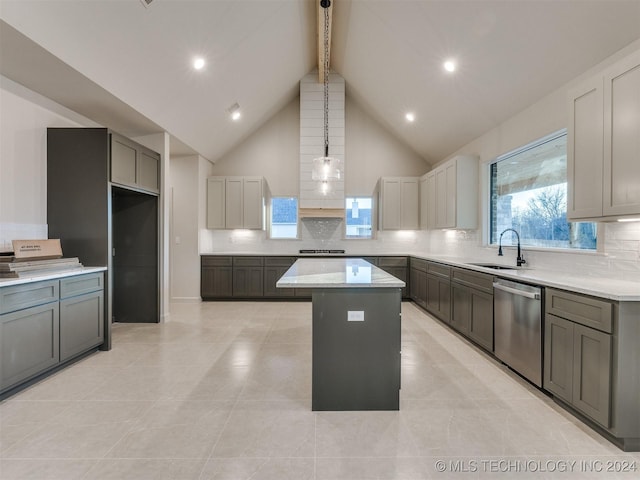 kitchen featuring dishwasher, sink, gray cabinets, decorative light fixtures, and a kitchen island