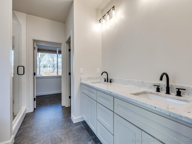 bathroom featuring vanity and a shower with shower door