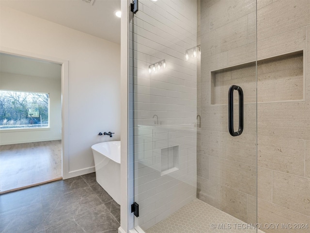 bathroom with plus walk in shower and tile patterned floors