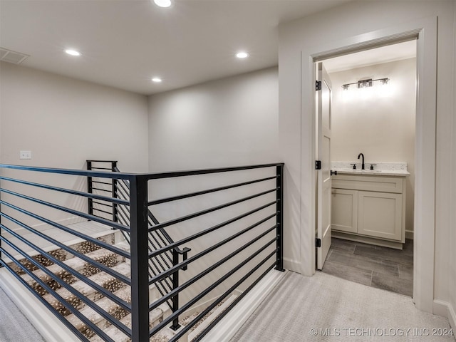 interior space with visible vents, recessed lighting, wood finished floors, and a sink