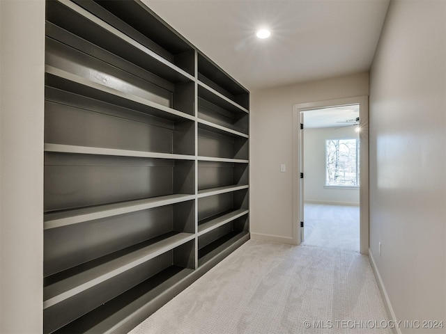 hall featuring carpet flooring, recessed lighting, and baseboards