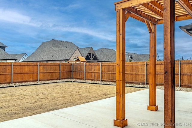 view of yard with a patio, a fenced backyard, and a pergola