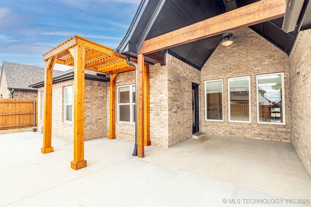 view of patio / terrace featuring fence