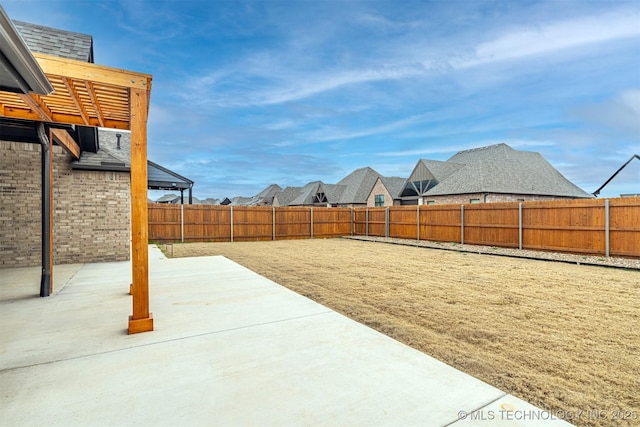 view of yard featuring a fenced backyard and a patio