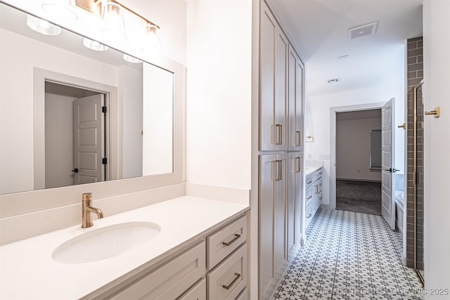 bathroom with visible vents and vanity