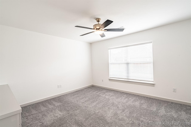 empty room featuring ceiling fan, baseboards, and carpet flooring