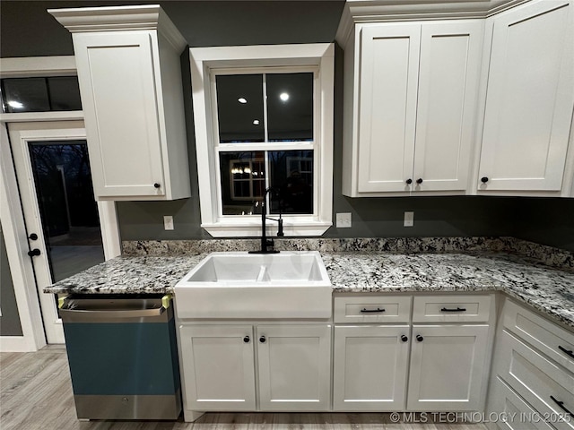 kitchen with white cabinetry and stainless steel dishwasher