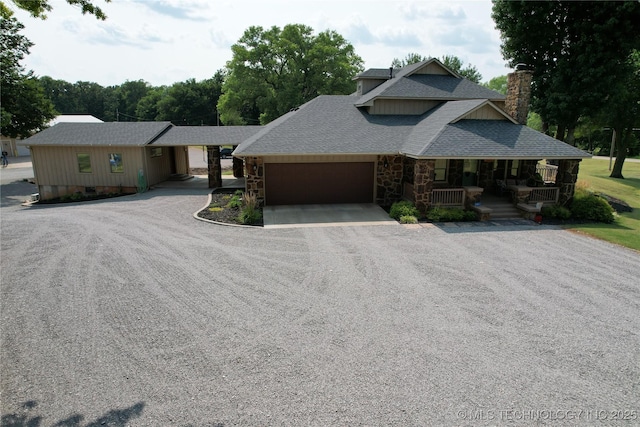 craftsman-style home with covered porch and a garage