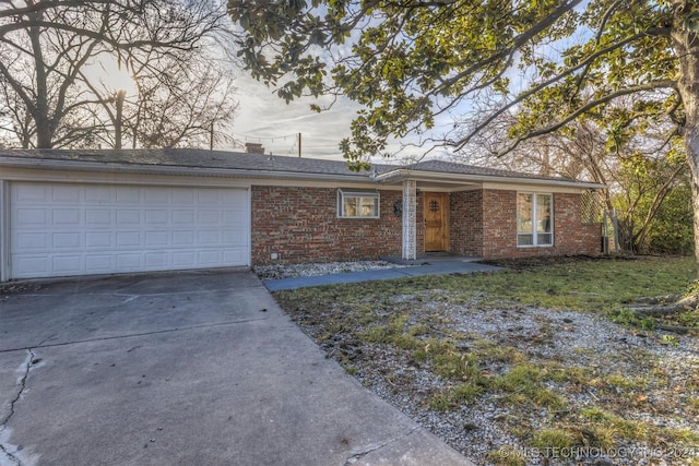 ranch-style home featuring a garage