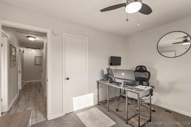 office space featuring light hardwood / wood-style flooring and ceiling fan