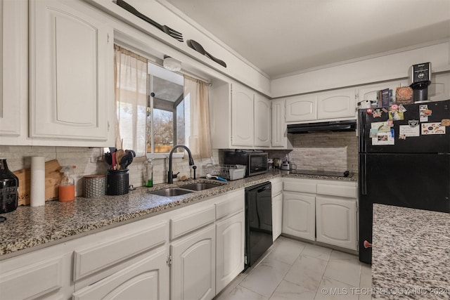 kitchen with white cabinetry, sink, tasteful backsplash, light stone counters, and black appliances