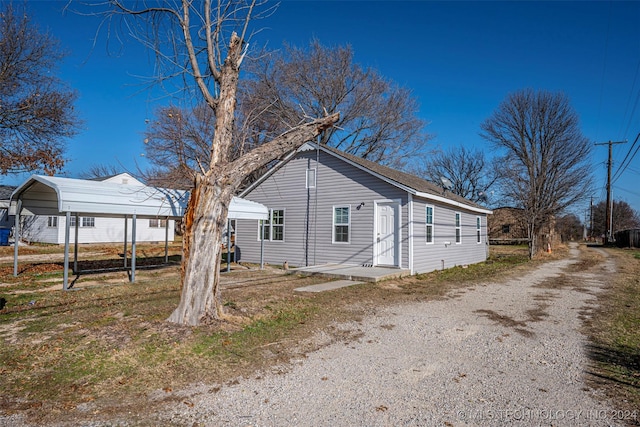 exterior space featuring a carport