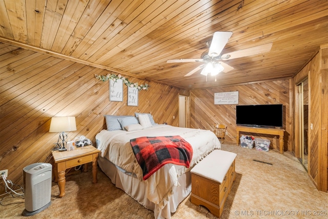 carpeted bedroom with ceiling fan and wooden ceiling