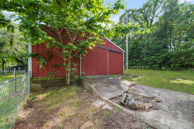 view of outbuilding with a yard