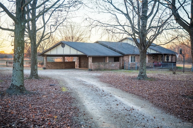 single story home featuring a carport