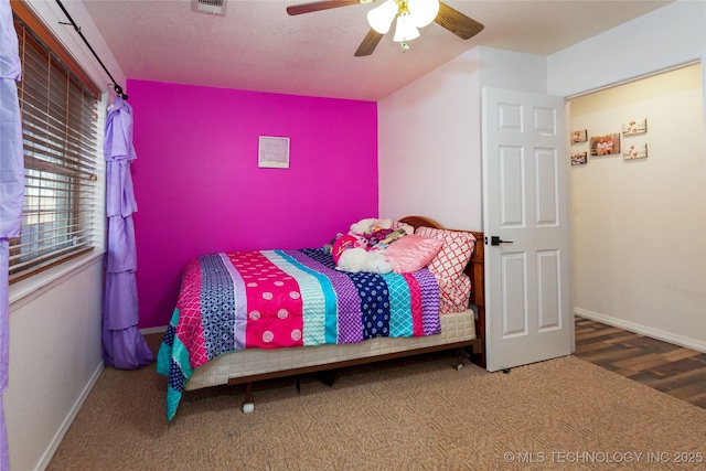 carpeted bedroom with ceiling fan