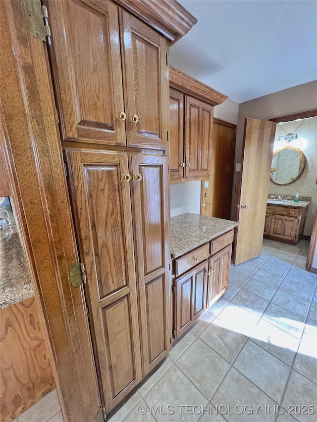 kitchen with sink and light tile patterned floors