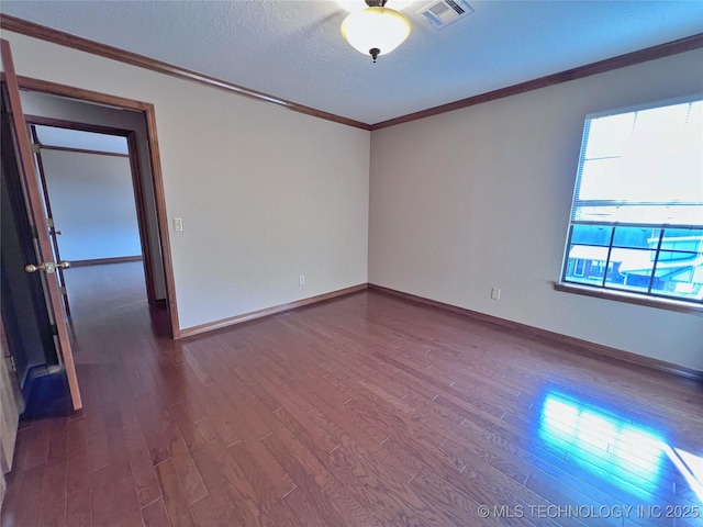 unfurnished room with wood-type flooring, a textured ceiling, and crown molding