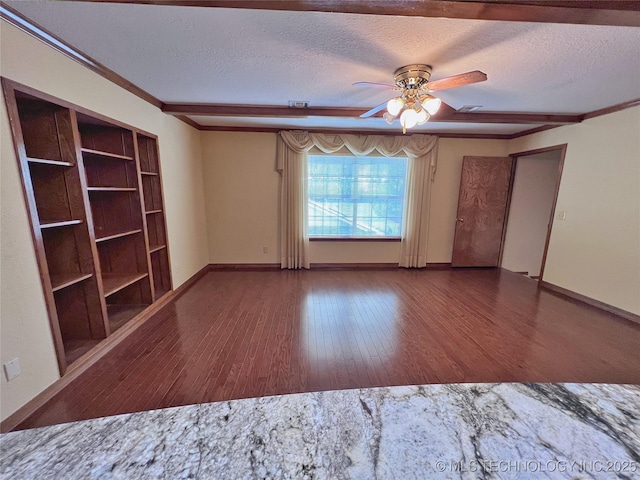 unfurnished room featuring ceiling fan, dark hardwood / wood-style floors, crown molding, and a textured ceiling