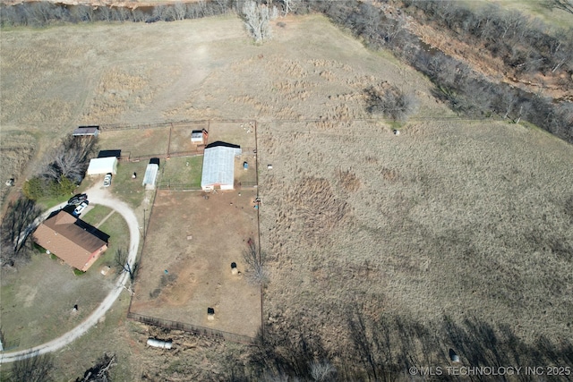 birds eye view of property with a rural view