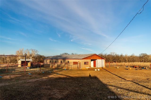 exterior space with an outbuilding and a rural view