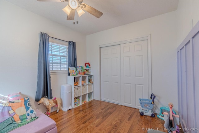 game room with hardwood / wood-style flooring and ceiling fan