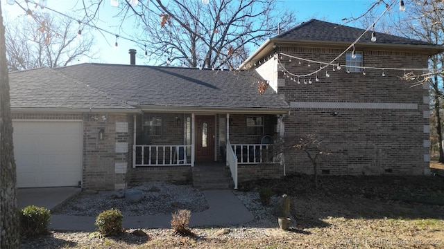 view of front of home with a porch and a garage