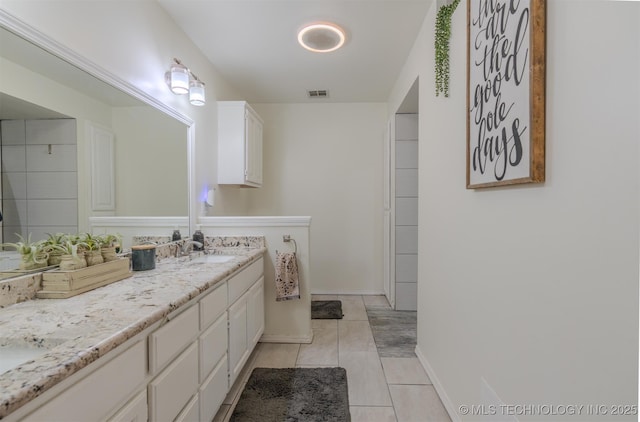 bathroom featuring tile patterned floors and vanity