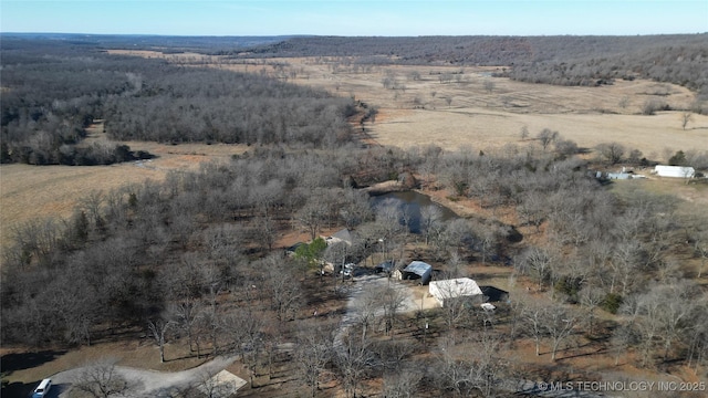 birds eye view of property with a rural view