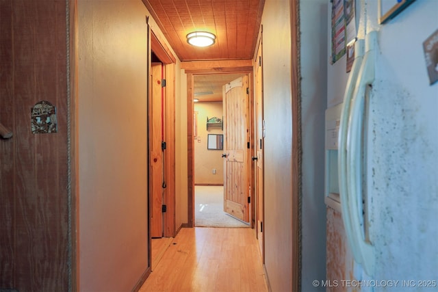 hall with light hardwood / wood-style floors