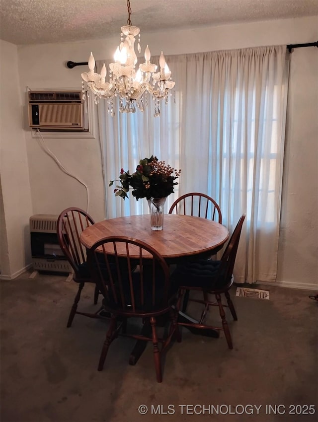 dining space with a textured ceiling, a wall mounted AC, a notable chandelier, carpet floors, and heating unit