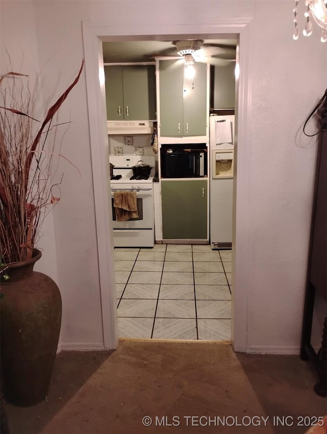 kitchen with ceiling fan, light tile patterned floors, and white appliances