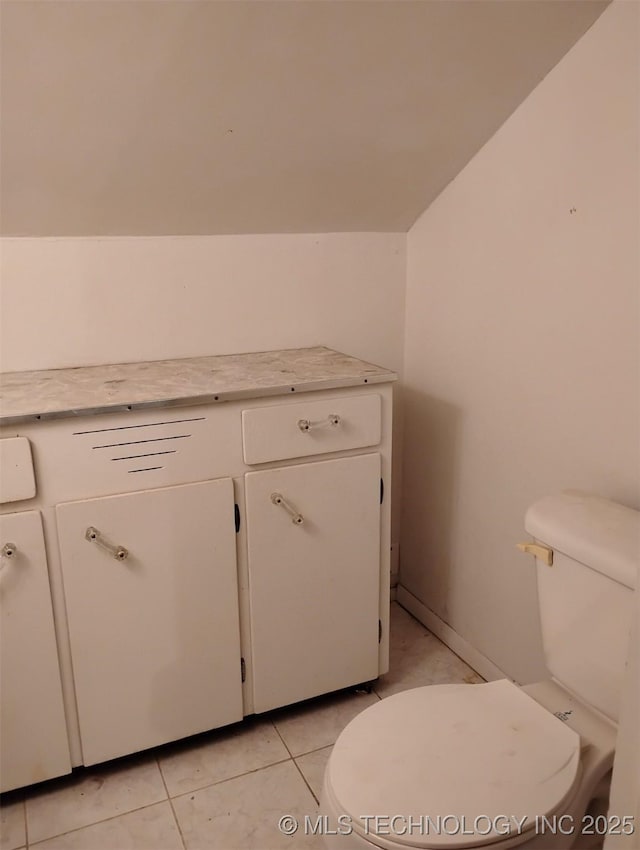 bathroom featuring tile patterned floors and toilet