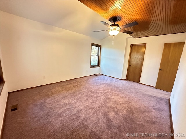 unfurnished bedroom with carpet, vaulted ceiling, and ceiling fan