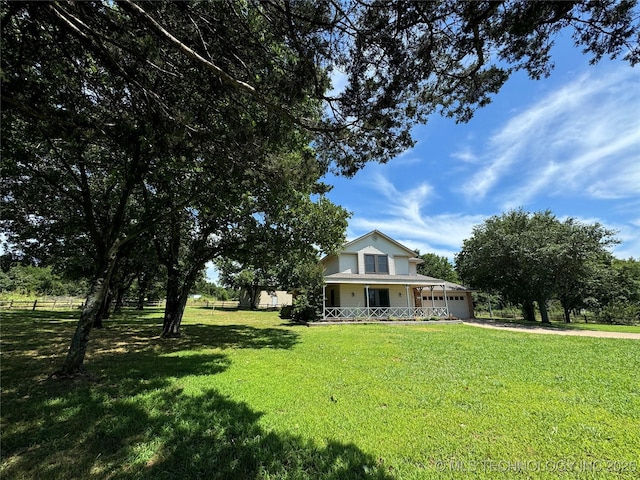 view of front of home with a front lawn and covered porch