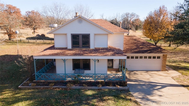 view of front facade featuring a porch and a garage